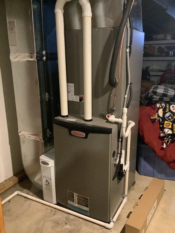 Completed annual maintenance tune-up on 1.5-year-old Lennox gas furnace and central air conditioning system. Performed comprehensive inspection of furnace including heat exchanger, burner assembly, ignition system, and PVC venting. Checked and tested all electrical connections, verified proper operation of blower motor and flame sensor. Inspected condensate drain system and confirmed proper drainage. On outdoor AC unit, checked refrigerant pressures, cleaned condenser coil, tested capacitor function and contactor operation, and verified proper amperage draw on compressor and fan motor. All components found operating within manufacturer specifications with no issues identified. System running efficiently and ready for continued service.