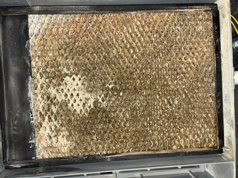 Completed comprehensive furnace tune-up including inspection of blower motor assembly with programmable ECM motor and air filtration system. Filter showed moderate dust accumulation and was inspected as part of routine maintenance; all mechanical components operating within normal parameters and system tested for proper airflow and functionality.