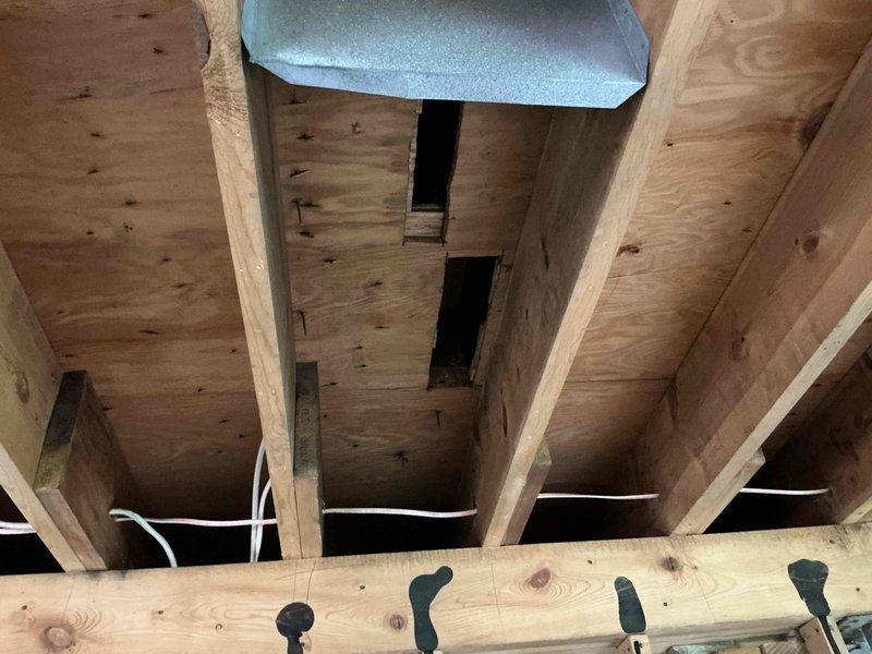 Completed comprehensive HVAC system replacement estimate including furnace, evaporator coil, and ductwork modifications. Documented existing structural conditions showing exposed framing, electrical routing, and attic space access points to assess installation requirements and clearances for new equipment placement.