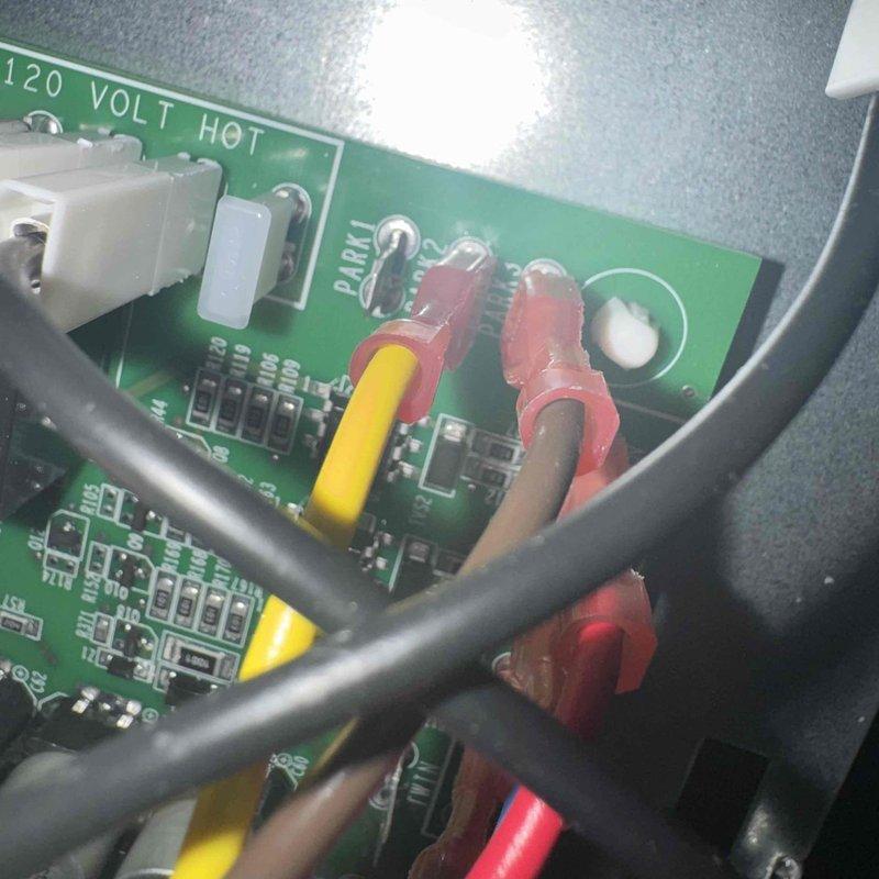 Responded to service call for furnace making unusual noise and hesitating during startup. Upon inspection, performed diagnostic testing on the control board (PCB) that was recently installed. Connected test leads to circuit board terminals to verify proper voltage and component function at the 120-volt hot connections. Inspected all wire connections, terminal blocks, and electronic components for loose connections or signs of failure. System tested and found operating within normal parameters after diagnostic evaluation.