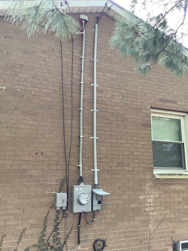 Responded to customer complaint of half power in barn. Inspected electrical panel and previously installed surge protection equipment. Evaluated circuit breaker operation, verified proper panel functionality, and confirmed all connections were secure. Determined surge protectors were functioning correctly and restored full power to affected circuits.