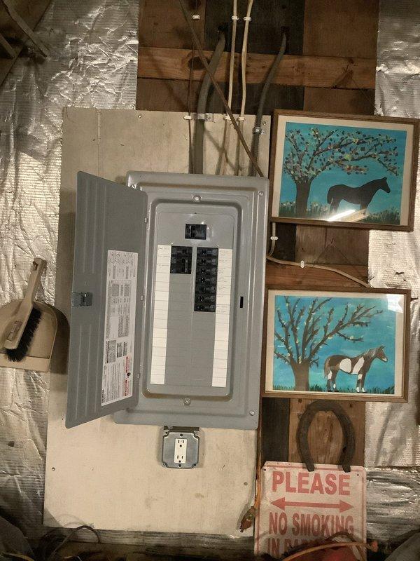 Responded to customer complaint of half power in barn. Inspected electrical panel and previously installed surge protection equipment. Evaluated circuit breaker operation, verified proper panel functionality, and confirmed all connections were secure. Determined surge protectors were functioning correctly and restored full power to affected circuits.