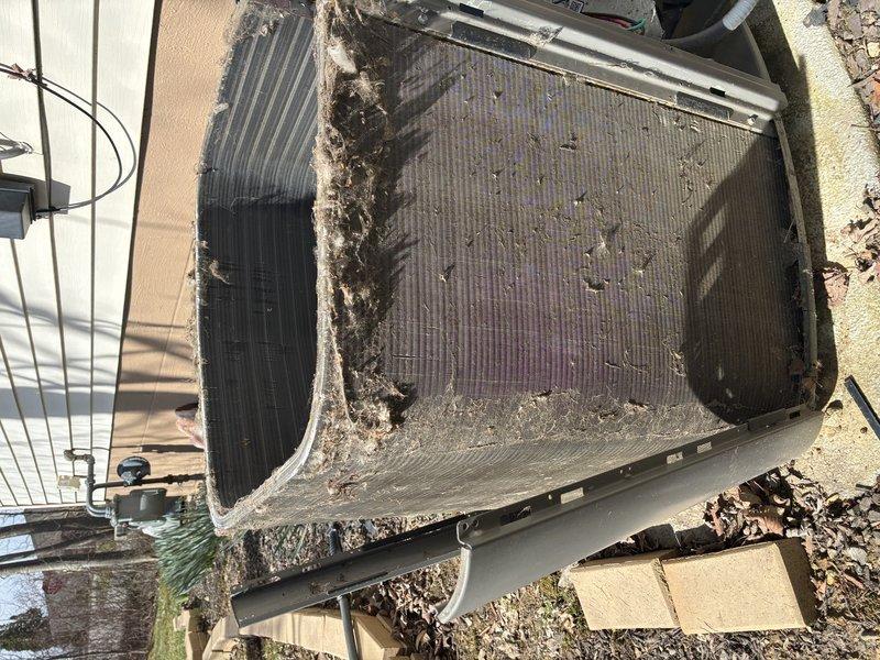 Completed Early Bird A/C tune-up on Bryant condenser unit. Upon arrival, found condenser coils heavily clogged with dirt, leaves, and organic debris causing restricted airflow. Performed thorough coil cleaning to remove accumulated contamination, restoring proper heat transfer efficiency. Inspected electrical connections, verified refrigerant pressures, and tested system operation to ensure optimal cooling performance for the upcoming season.