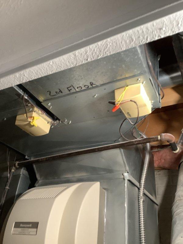 Conducted comprehensive site evaluation for complete furnace and air conditioning system replacement. Assessed existing HVAC infrastructure including exterior disconnect box, refrigerant line set with brass flare connections, basement ductwork labeled for second floor zoning, and Honeywell humidifier integration to provide accurate equipment sizing and installation specifications for replacement estimate.