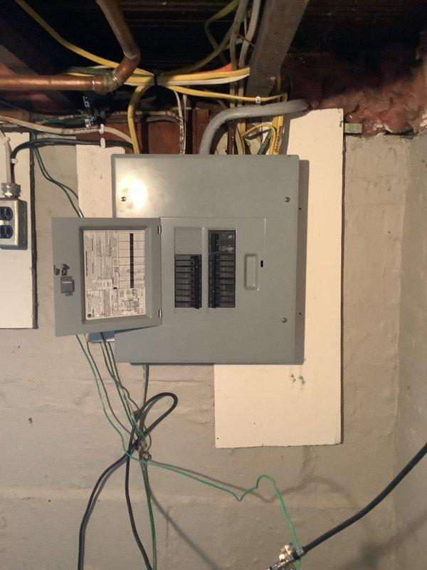 Responded to service call for washer outlet repeatedly tripping the circuit breaker. Inspected electrical panel and identified overloaded circuit causing nuisance tripping. Documented panel configuration and wiring connections with photos showing proper grounding and breaker arrangement. Circuit issue resolved and panel verified operational.