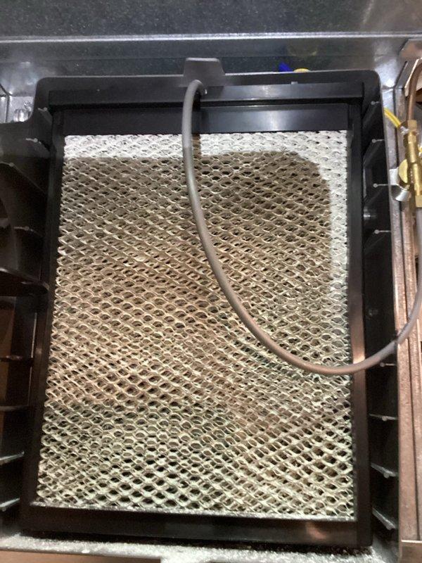 Completed heating system tune-up on two-year-old HVAC unit. Performed comprehensive inspection of furnace components including blower assembly, gas valve, electrical connections, and control board. Inspected humidifier system and noted moderate mineral buildup and discoloration on evaporator pad, which is functioning but showing typical wear from water quality. All electrical connections secure, blower motor operating properly, and system tested for safe operation. Unit is in good overall condition for its age with normal maintenance requirements.