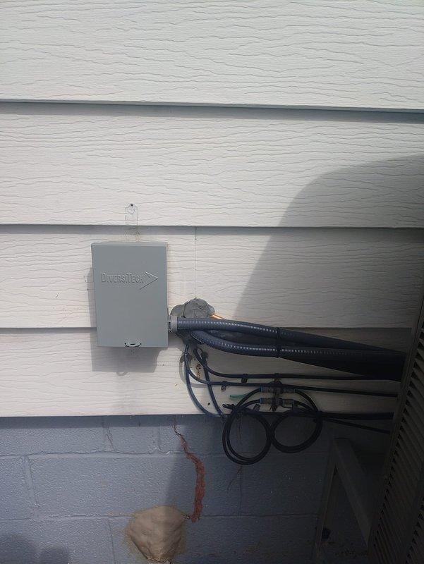 Completed installation of a new furnace and air conditioning system at 90% efficiency rating. Mounted the outdoor AC unit on elevated brackets per manufacturer specifications. Installed Diversitech disconnect box on exterior wall with proper conduit routing and cable management using secure mounting brackets. Replaced dual 20-amp Class RK5 fuses (Littelfuse FLNR rated) in the disconnect to ensure proper electrical protection for the new equipment. All electrical connections were secured and tested for proper operation. System commissioned and verified operational.