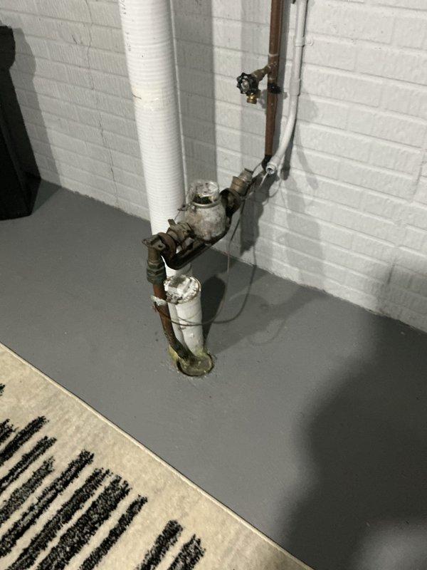 Responded to emergency no-water situation caused by failed main water line. Upon inspection, identified compromised mainline with significant corrosion, mineral buildup, and deteriorated pipe connections in the basement plumbing assembly. The existing copper piping system showed advanced oxidation with greenish patina and brown discoloration throughout multiple connection points. Main shutoff valve and brass valve body connections exhibited extensive aging and white mineral deposits indicating long-term water quality issues.

Conducted camera inspection of main sewer/water line opening, revealing heavy sediment accumulation, rust-colored deposits on threaded couplings, and corroded metal components. The pipe interior showed significant scaling and debris buildup affecting water flow capacity. Assessed the threaded connection points which displayed severe corrosion requiring immediate replacement to restore water service.

Performed mainline repair by replacing damaged sections of pipin