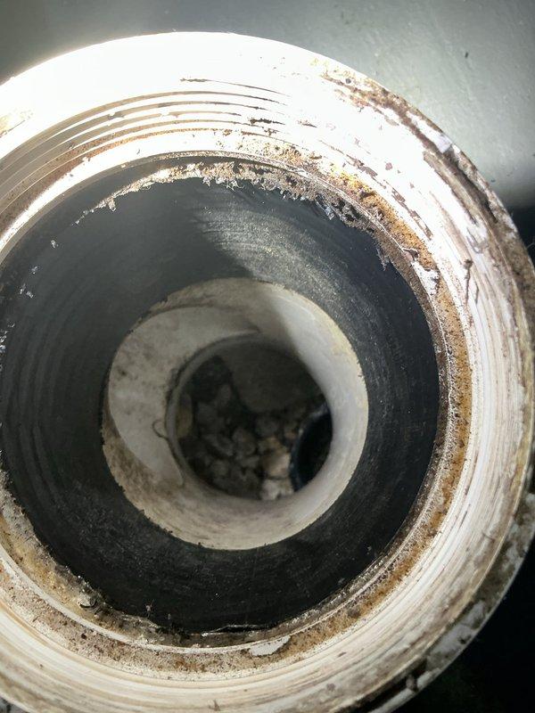 Responded to emergency no-water situation caused by failed main water line. Upon inspection, identified compromised mainline with significant corrosion, mineral buildup, and deteriorated pipe connections in the basement plumbing assembly. The existing copper piping system showed advanced oxidation with greenish patina and brown discoloration throughout multiple connection points. Main shutoff valve and brass valve body connections exhibited extensive aging and white mineral deposits indicating long-term water quality issues.

Conducted camera inspection of main sewer/water line opening, revealing heavy sediment accumulation, rust-colored deposits on threaded couplings, and corroded metal components. The pipe interior showed significant scaling and debris buildup affecting water flow capacity. Assessed the threaded connection points which displayed severe corrosion requiring immediate replacement to restore water service.

Performed mainline repair by replacing damaged sections of pipin