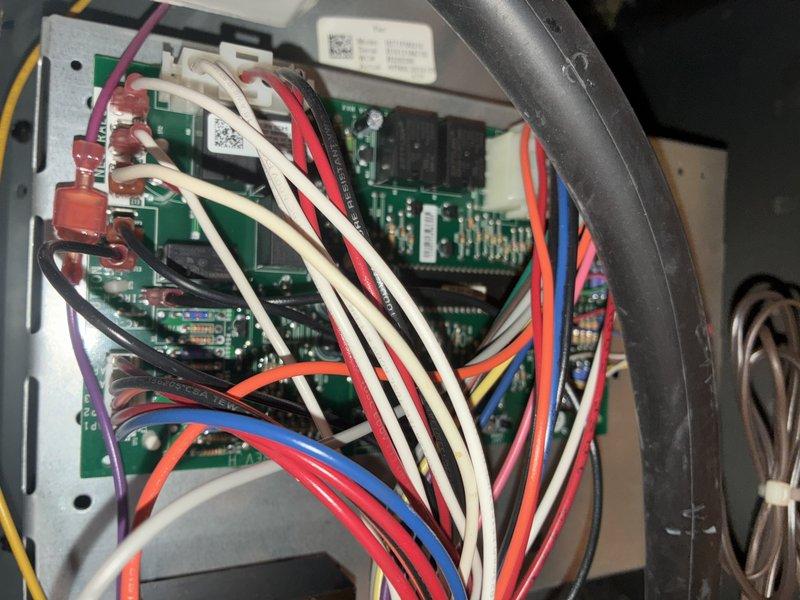 # HVAC Maintenance Service Completed

Performed comprehensive preventive maintenance on a 5-year-old air conditioning system under manufacturer's MVP warranty program. Conducted thorough inspection of control board assembly, verifying proper operation of all integrated circuits, capacitors, and electrical connections across multiple PCBs within the control panel. Examined wire harness integrity, confirming secure terminations and proper routing of all low and line voltage wiring. Inspected exterior disconnect box and electrical conduit connections for weatherproofing and code compliance. All system components found operating within normal parameters with no deficiencies noted. Unit tested and left in proper working condition.