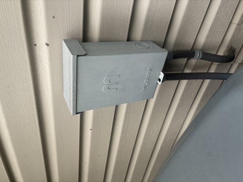 # HVAC Maintenance Service Completed

Performed comprehensive preventive maintenance on a 5-year-old air conditioning system under manufacturer's MVP warranty program. Conducted thorough inspection of control board assembly, verifying proper operation of all integrated circuits, capacitors, and electrical connections across multiple PCBs within the control panel. Examined wire harness integrity, confirming secure terminations and proper routing of all low and line voltage wiring. Inspected exterior disconnect box and electrical conduit connections for weatherproofing and code compliance. All system components found operating within normal parameters with no deficiencies noted. Unit tested and left in proper working condition.