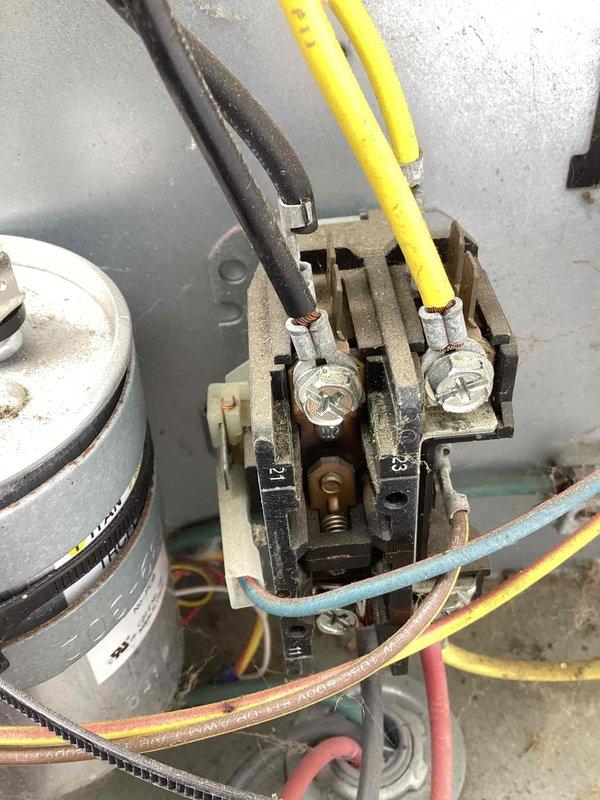 Completed Early Bird Tune-Up on 17-year-old Carrier HVAC system. Performed comprehensive inspection of furnace unit, ductwork, and air conditioning components in basement mechanical installation. Inspected electrical contactor assembly, verified wire connections on terminals, and examined capacitor condition. All components functioning within normal parameters for unit age, with typical wear and dust accumulation noted on electrical housing and terminals.