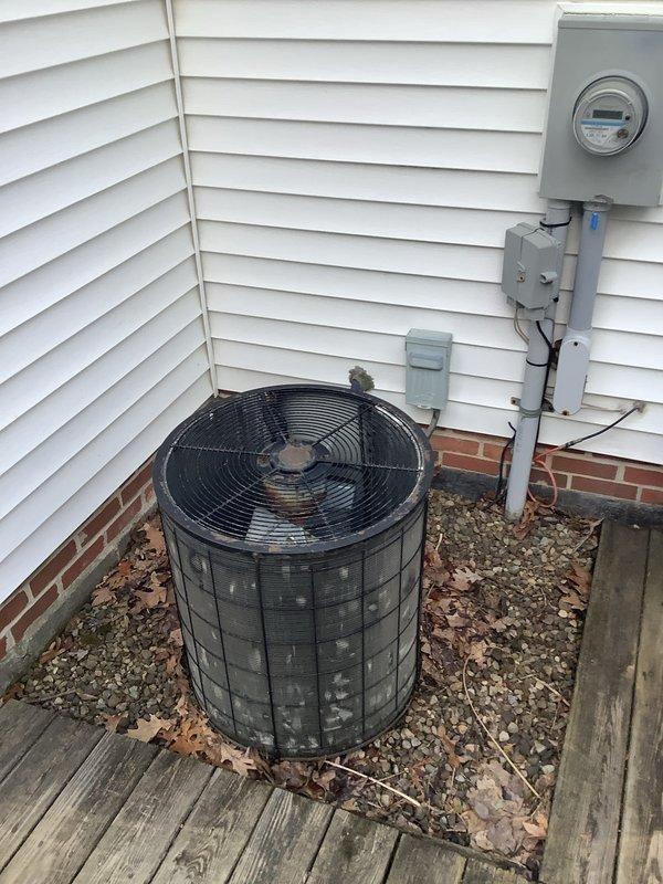 Completed installation of a new 80% efficiency furnace and air conditioning system at residential property. The outdoor AC condenser unit was positioned on the wooden deck with proper gravel base for drainage and vibration dampening, with all electrical connections routed through weatherproof conduit to the existing meter panel. Inside the basement, installed the new furnace unit with appropriate ductwork connections, ensuring proper airflow distribution through the existing duct system and secure mounting on the concrete floor against the foundation wall.