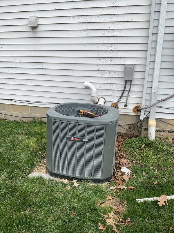 Completed routine maintenance on a 10-year-old Trane air conditioning system. Inspected outdoor condensing unit and confirmed proper operation of all components. Checked and documented condition of air filter, which showed normal dust accumulation and was due for replacement. Verified electrical connections at disconnect box, examined condensate drain line for proper drainage, and ensured unit was level on concrete pad. System operating within normal parameters with no immediate repairs required.