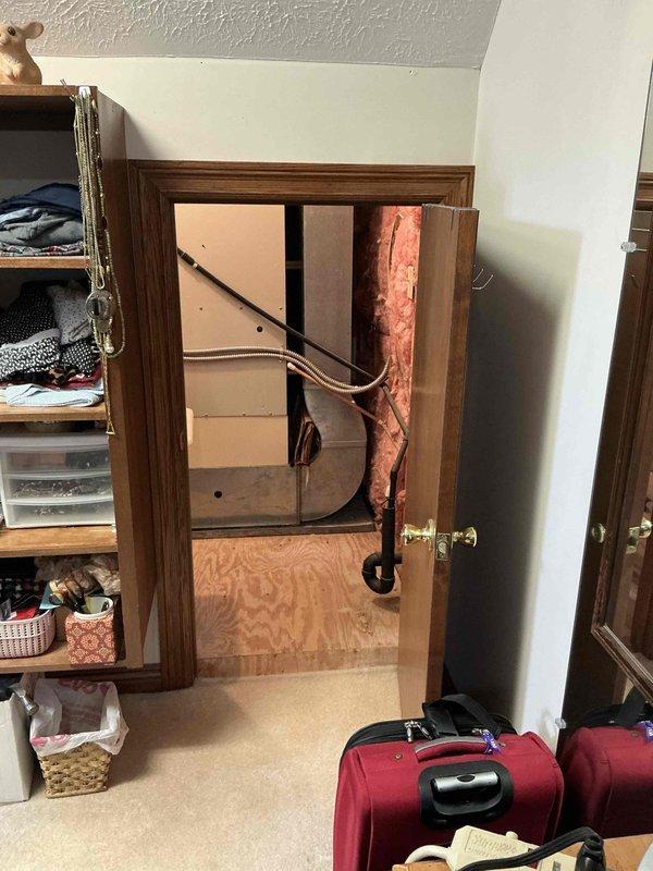 Completed dual system HVAC replacement estimate for furnace and air conditioning units. Assessed existing furnace installation in basement utility area, including current PVC condensate drainage configuration, refrigerant line routing, and electrical connections. Evaluated second system location in unfinished residential space with exposed framing and determined equipment placement, ductwork modifications, and infrastructure requirements for new installation.