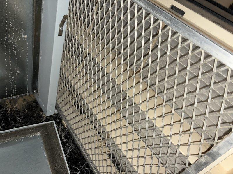 Completed comprehensive furnace tune-up and system inspection. Identified heavily soiled air filter with significant dust and debris accumulation throughout the mesh structure, restricting proper airflow to the system. Recommended filter replacement to restore optimal system performance and indoor air quality.