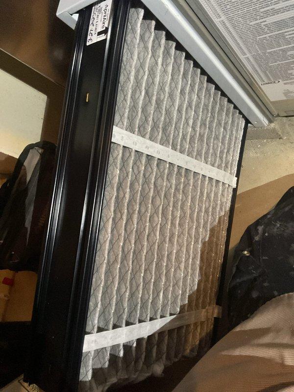 Completed routine furnace tune-up and system inspection as scheduled. Inspected and evaluated existing air filter condition, which showed moderate dust accumulation and debris buildup requiring attention. Accessed HVAC filter housing unit and performed standard maintenance procedures to ensure optimal system performance and air quality for the heating season.