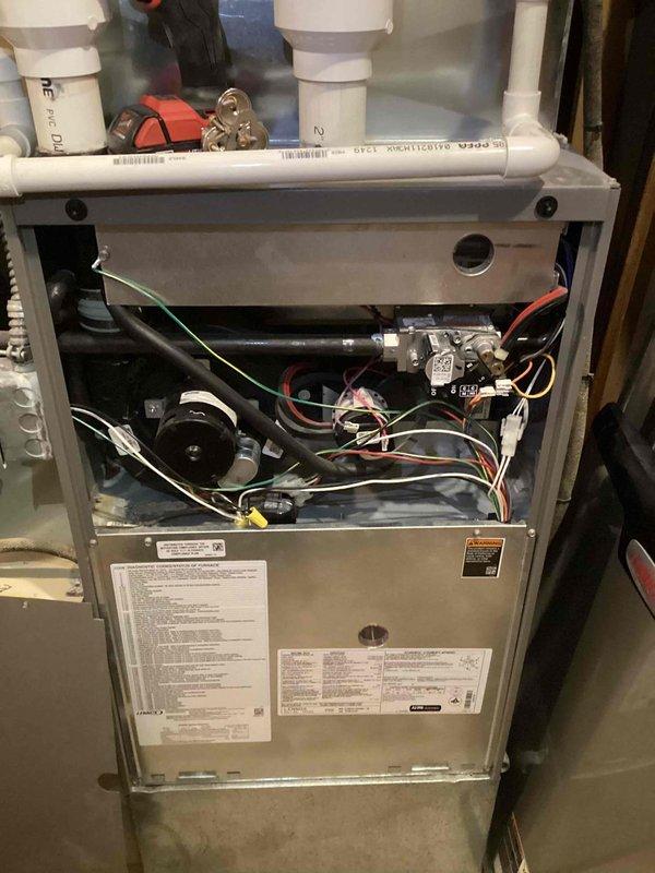 Completed MVP recurring cooling maintenance visit on residential HVAC system. Performed comprehensive inspection of furnace and air conditioning components, including examination of blower motor, electrical connections, gas lines, and refrigerant piping. Documented equipment condition through photographic records showing plenum assembly, copper refrigerant lines with brass fittings, condensate drain lines, and internal furnace components. All systems operational with no immediate service needs identified.