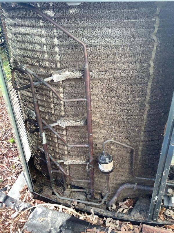 Completed comprehensive furnace tune-up on outdoor HVAC unit, inspecting electrical connections, capacitor, contactors, and refrigerant lines. Documented existing dirt accumulation on condenser coil and general weathering of components consistent with outdoor installation. System operational with membership offer presented for ongoing maintenance services.