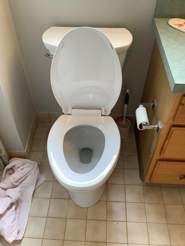 Replaced existing Mansfield toilet on second floor with new American Standard Cadet chair height model featuring elongated bowl and installed new shut off valve. Replaced front home sillcock with new Woodford frost-free unit, which required opening drywall to access interior piping and installing access panel for future maintenance accessibility.