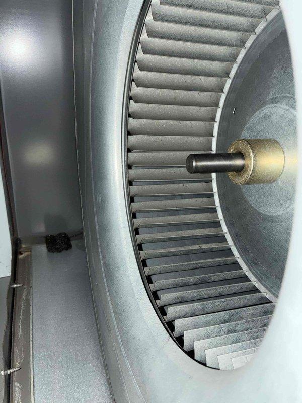 Completed heating maintenance visit for MVP customer. Performed thorough inspection of air handler blower assembly, documenting condition of squirrel cage fan wheel with noted dust accumulation on blades and verifying proper operation of motor shaft and mounting components. System operating within normal parameters.