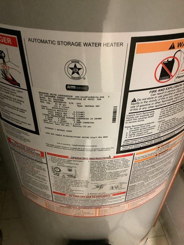 Installed a new 40-gallon tall Bradford White automatic storage water heater with 10-year warranty in residential utility room. Installation included 3/4-inch ball valve for shutoff control, 3/4-inch thermal expansion tank to protect against pressure buildup in closed plumbing systems, proper electrical bonding of water heater per code requirements, and connection of copper supply lines with appropriate fittings. Unit was installed adjacent to existing HVAC equipment, with all safety labels and manufacturer specifications clearly visible and intact upon completion.