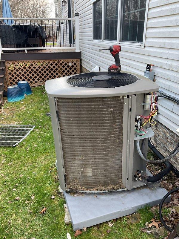 Completed MVP Cooling Visit maintenance on residential air conditioning system. Performed comprehensive inspection of outdoor condenser unit, cleaned protective metal grille guards that showed dirt and debris accumulation, and verified proper operation of all components. Confirmed electrical connections, refrigerant line integrity, and overall system functionality with unit operating within normal parameters.