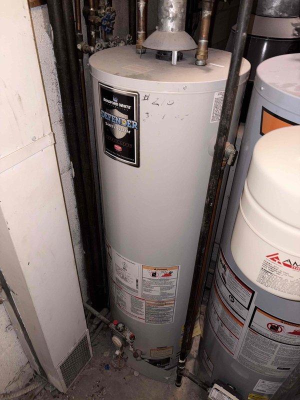 Performed estimate for boiler replacement in vacant condominium unit with existing 60-year-old boiler system. Assessed existing heating distribution system including copper piping, baseboard connections, and utility room configuration for potential boiler upgrade and ducted air conditioning installation with system reconnection.