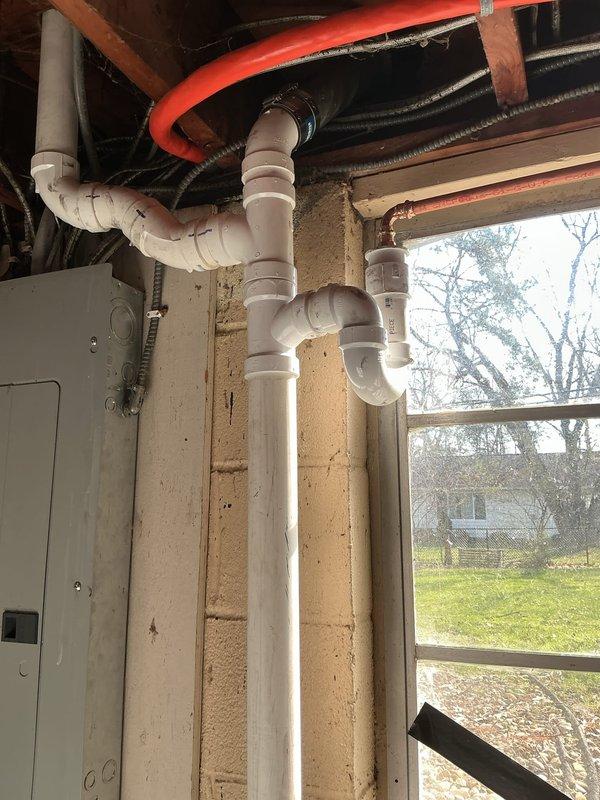 Replaced deteriorating galvanized drain piping and cast iron Durham elbows in basement with new PVC pipe and fittings. Cut into existing vent pipe and adapted to new drainage configuration. Rebuilt and reconfigured kitchen sink drain system in cabinet with new pipe, fittings, and installed air admittance valve. Replaced outdated garbage disposal with new InSinkerator 3/4 HP unit featuring quiet technology. Installed new basket strainer and tubular fittings to connect double bowl sink configuration. Snaked drain line in basement to ensure proper flow and eliminate backup issue.