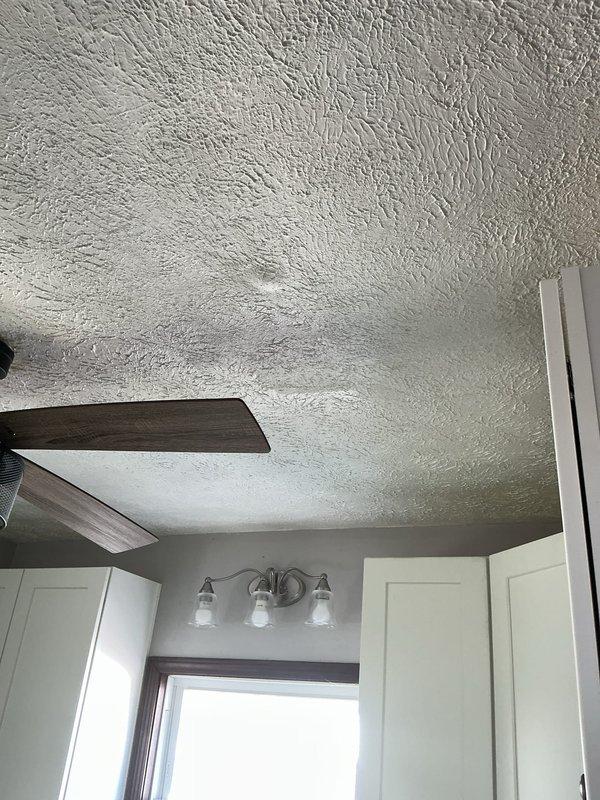 Responded to service call for leaking shower/tub seal. Conducted on-site inspection and provided free estimate as alternative to full shower replacement that customer had previously been quoted. Evaluated bathtub and shower combination unit with white fiberglass surround to assess seal integrity and determine source of water intrusion. Documented existing conditions with photographs for estimate purposes. Customer seeking more cost-effective repair solution rather than complete fixture replacement.