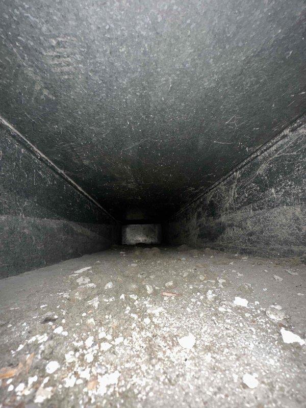 Completed comprehensive duct cleaning service for residential HVAC system consisting of 17 vents. System inspection revealed significant accumulation of dust, debris, and particulate matter throughout the ductwork, with heavy buildup on interior surfaces and floors of air channels. Performed thorough cleaning of all ventilation components, removing years of settled contaminants from metal duct surfaces and eliminating the substantial layer of dust and debris that had collected over time, restoring proper airflow and improving indoor air quality.