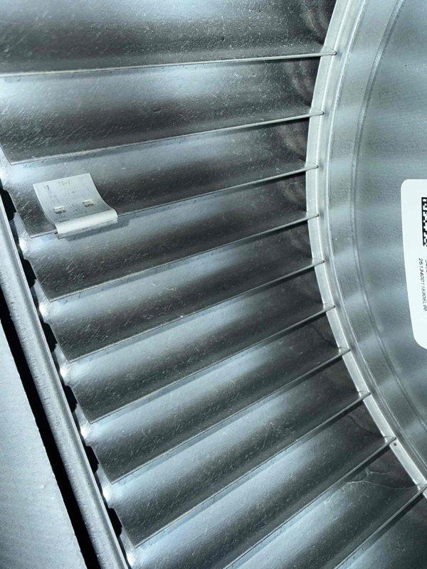 Installed surge protector from truck stock to protect HVAC system from electrical surges and power fluctuations. System showed evidence of frost buildup on evaporator coil and refrigerant lines, indicating potential airflow restriction or refrigerant charge issues that were addressed during service call.