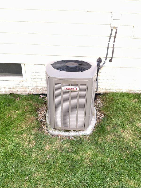 Completed routine maintenance on five-year-old Lennox air conditioning system and furnace. Inspected outdoor condenser unit, verified electrical connections and capacitor operation, cleaned accumulated debris from control panel and concrete pad, and confirmed proper refrigerant line insulation and secure mounting. All systems tested and operating within normal parameters.