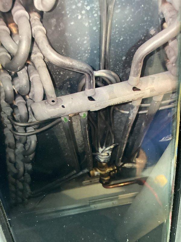 Completed comprehensive furnace maintenance including full system inspection and testing. Verified Aprilaire Model 60 humidifier operation with control panel showing normal status indicators; green "Humidifier On" light confirmed active operation while amber "Change Water Panel" light indicated scheduled maintenance due. Inspected all refrigerant lines, connections, and insulation throughout the system with no leaks or damage observed. All mechanical components, including compressor housing and brass fittings, found in proper working condition with system operating within manufacturer specifications.