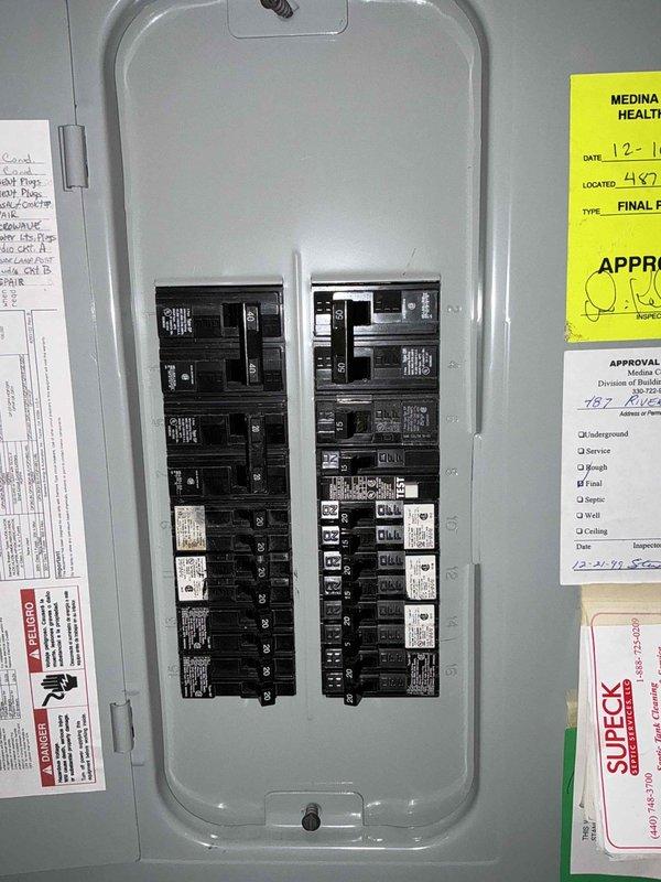Conducted on-site electrical assessment for generator installation at residential property. Documented existing electrical panel configuration and available space for generator integration. Property features accessible driveway with adequate turning radius for equipment delivery and installation. Photographed main service panel and subpanel locations to determine optimal transfer switch placement and circuit integration points for proposed backup power system.
