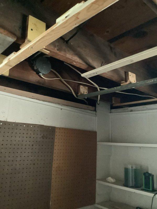 Conducted comprehensive electrical assessment for whole home rewire project. Evaluated existing electrical infrastructure throughout property, including inspection of basement utility areas, exposed ceiling joists, and current wiring systems. Documented existing conditions showing outdated wiring configurations, exposed structural framing requiring new circuit routing, and utility room electrical components. Assessment revealed need for complete residential rewiring with estimated 12-4 time frame for project completion. Provided detailed estimate covering full scope of electrical system replacement to bring property up to current code standards.