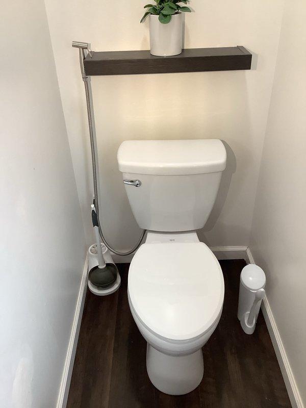 Responded to multiple drain blockages throughout a 20-year-old residence affecting bathroom sink, toilet, dishwasher, and shower. Upon arrival, performed systematic assessment of all affected fixtures to determine extent and location of clogs. 

Inspected main water supply lines and plumbing infrastructure in utility closet, noting copper piping with existing shut-off valves and flow control devices. Verified water pressure and supply functionality to rule out main line issues. Assessed condition of visible plumbing connections and support brackets.

Cleared bathroom sink drain using appropriate augering techniques to remove accumulated debris and buildup. Addressed toilet blockage through mechanical snaking, successfully restoring proper flush and drainage function. Cleared shower drain obstruction, removing hair and soap residue buildup that had accumulated over time.

Investigated dishwasher drainage issue, checking air gap, drain hose routing, and connection to garbage disposal or 