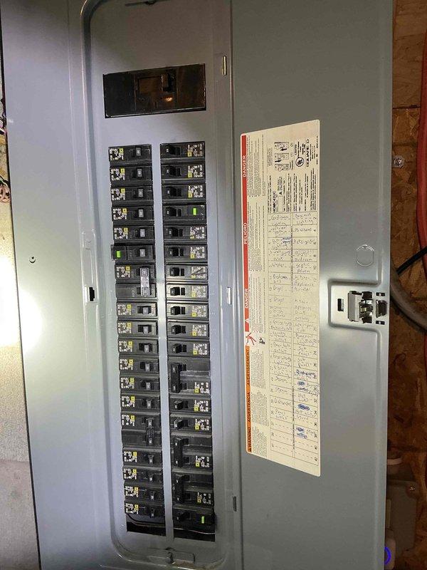 Conducted on-site evaluation for whole house generator installation at residential property. Assessed existing electrical infrastructure, including main service panel and available breaker capacity. Documented current electrical panel configuration showing dual-column breaker arrangement with mixed amperage circuits. Evaluated panel location in utility area with exposed wall framing, noting accessibility for required transfer switch installation and generator feed connections. Photographed existing electrical system to determine load calculations and proper sizing requirements for backup power system. Identified mounting location considerations and electrical routing path from proposed generator location to main service entrance. Assessment complete for preparation of detailed installation estimate including generator unit specifications, automatic transfer switch requirements, and necessary electrical modifications to integrate whole house backup power system.