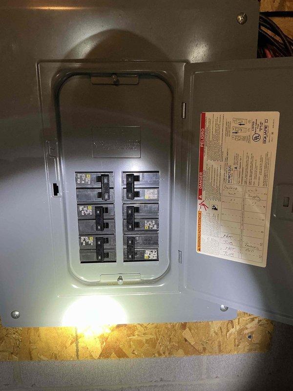 Conducted on-site evaluation for whole house generator installation at residential property. Assessed existing electrical infrastructure, including main service panel and available breaker capacity. Documented current electrical panel configuration showing dual-column breaker arrangement with mixed amperage circuits. Evaluated panel location in utility area with exposed wall framing, noting accessibility for required transfer switch installation and generator feed connections. Photographed existing electrical system to determine load calculations and proper sizing requirements for backup power system. Identified mounting location considerations and electrical routing path from proposed generator location to main service entrance. Assessment complete for preparation of detailed installation estimate including generator unit specifications, automatic transfer switch requirements, and necessary electrical modifications to integrate whole house backup power system.