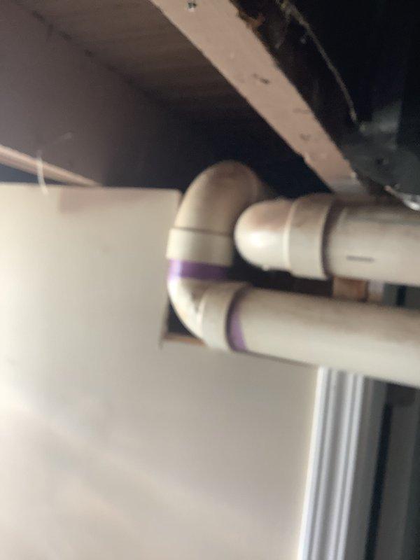 Completed HVAC estimate for furnace replacement at residential property. Evaluated existing 19-year-old furnace system, assessed current equipment condition showing significant age-related wear and dust accumulation, documented existing PVC condensate drain configuration and venting infrastructure, and photographed mechanical room layout including furnace unit, electrical connections, and associated plumbing components to provide comprehensive replacement quote.