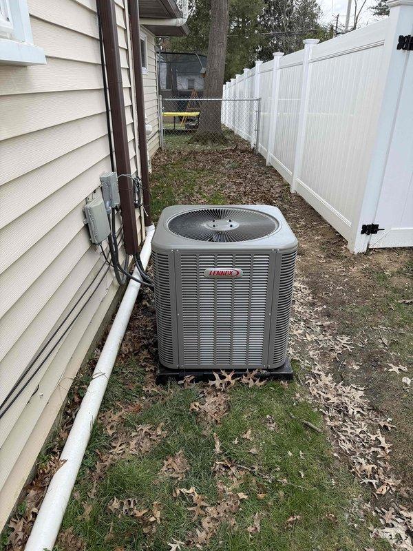 Completed installation of new 80% efficiency furnace in attic and outdoor air conditioning condenser unit. Installed Lennox AC condenser in side yard with proper electrical disconnect, conduit routing along house siding, and PVC condensate drain line. Mounted and tested Kidde carbon monoxide alarm as part of system safety requirements. All equipment installed to manufacturer specifications with proper electrical connections and refrigerant lines. System tested and operating normally.