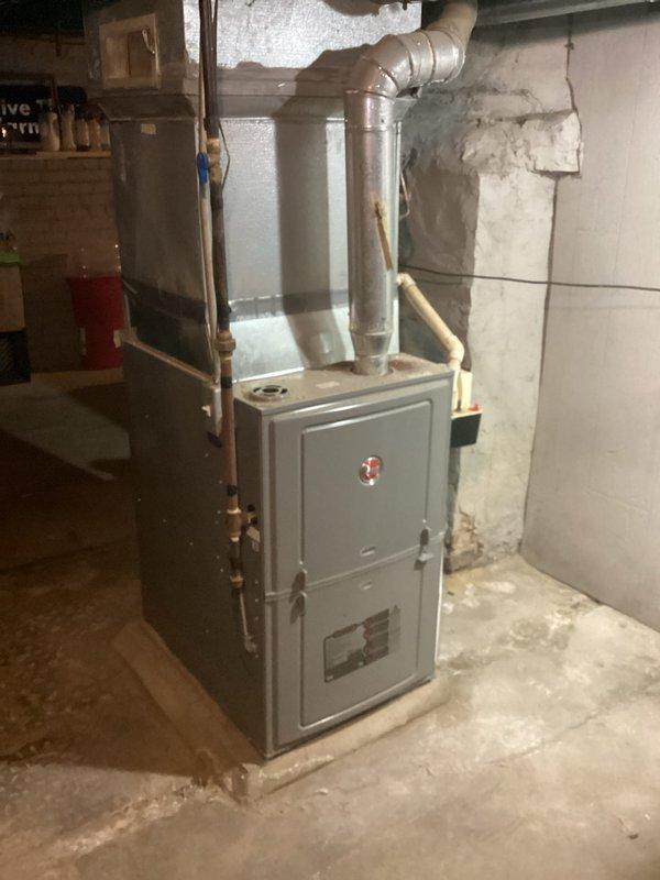 Completed comprehensive heating system maintenance tune-up on residential furnace unit in basement location. Performed standard preventive maintenance procedures including inspection of all accessible components, burner assembly, heat exchanger, blower motor, and ductwork connections. System found to be operating within normal parameters with visible signs of age-related corrosion on metal components noted during inspection.