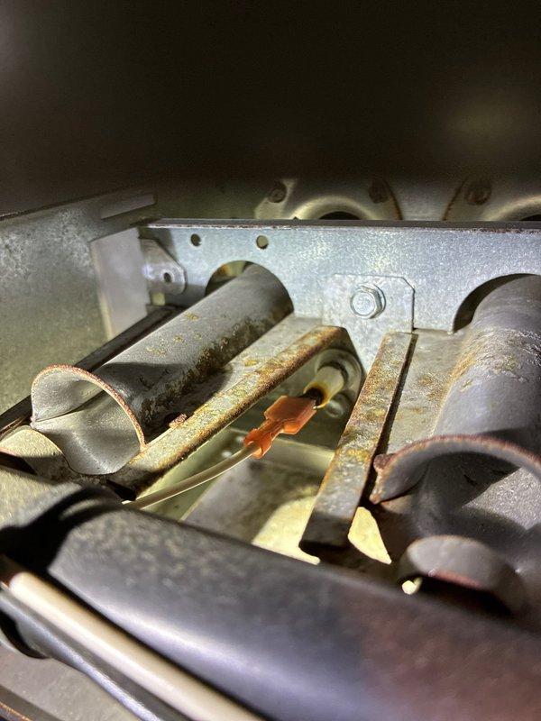 Completed heating maintenance visit for MVP customer. Upon inspection, discovered significant rust and corrosion on heat exchanger tubes and burner assemblies, indicating potential safety concerns and reduced system efficiency. Performed diagnostic testing on control board using voltage meter to verify proper system operation and LED indicator functionality. Documented equipment condition with photos showing corroded components and control board status for customer records and future service reference.