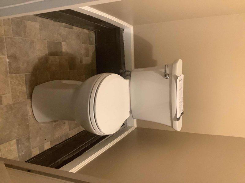 Installed customer-supplied toilet in bathroom, including installation of new angle stop valve on the water supply line. All fixtures were properly secured, tested for leaks, and confirmed operational upon completion.