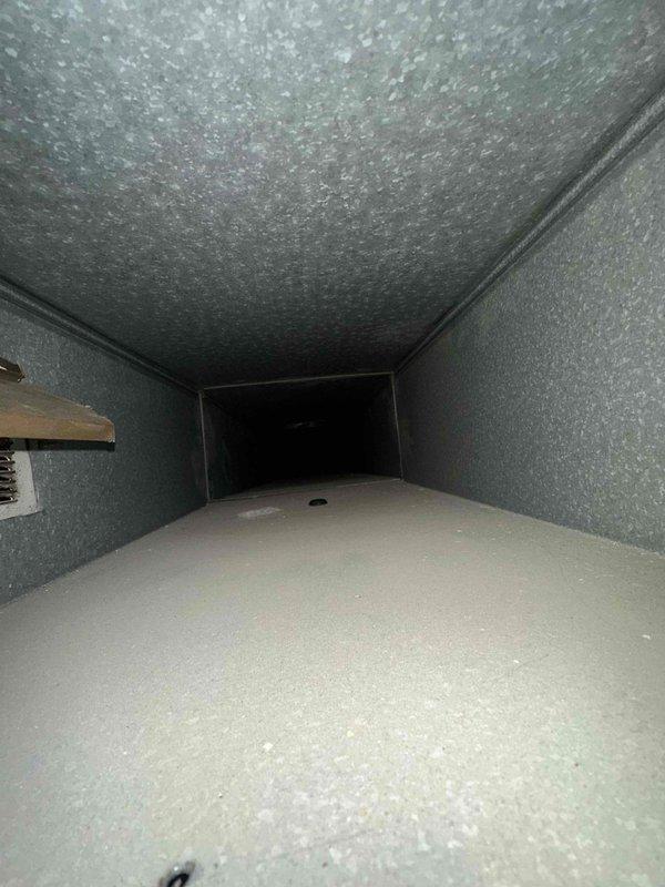 Completed dryer vent cleaning service as scheduled while duct cleaning was postponed pending homeowner preparation. Inspected ductwork system and documented current conditions, revealing dust accumulation, debris, and fibrous insulation deterioration throughout the ventilation channels. Successfully cleaned and cleared the dryer vent exhaust system to restore proper airflow and reduce fire hazard risk.