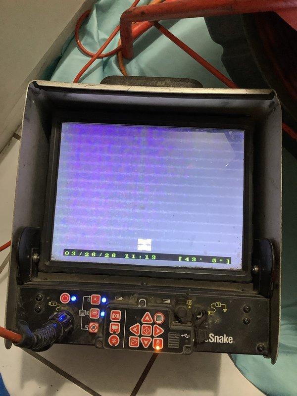 Responded to recurring main drain clog caused by severe grease accumulation. Attempted drain cleaning procedures but was unable to clear the blockage due to the extent of buildup. Deployed video camera inspection equipment through cleanout access point to assess drain line condition and document the severity of grease obstruction for further remediation planning.