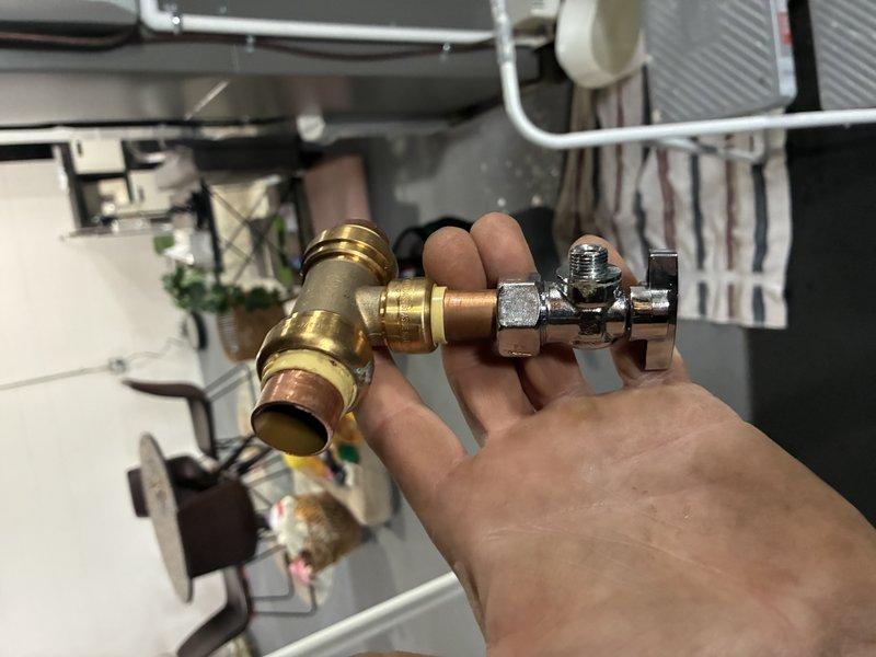 Responded to customer report of water leak following recent maintenance visit. Upon inspection, identified leak originating from humidifier water supply line connection. Replaced faulty angle stop valve and brass compression fitting that had developed seepage. Verified all connections secure, tested system operation, and confirmed no further leakage from HVAC unit or associated plumbing components.