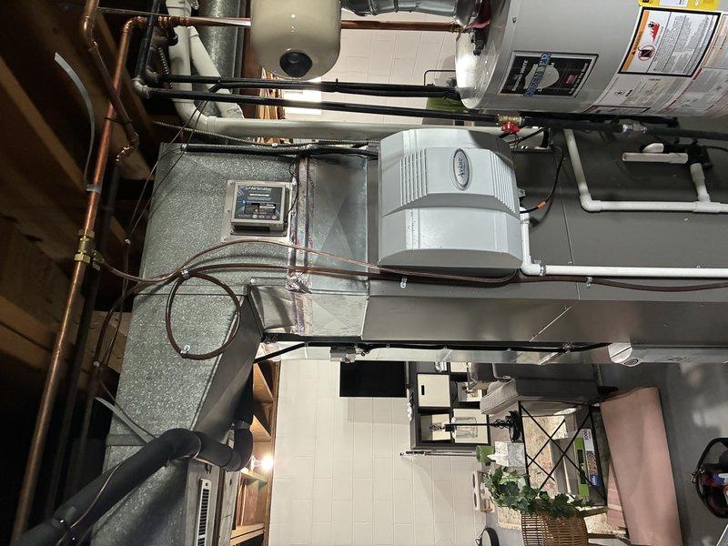 Responded to customer report of water leak following recent maintenance visit. Upon inspection, identified leak originating from humidifier water supply line connection. Replaced faulty angle stop valve and brass compression fitting that had developed seepage. Verified all connections secure, tested system operation, and confirmed no further leakage from HVAC unit or associated plumbing components.