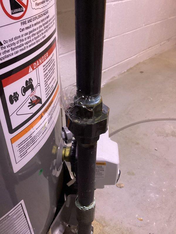 Responded to service call for odor in furnace room and thermostat beeping issue. Performed thorough inspection of furnace unit and associated components, including visual examination of internal components, heat exchanger, blower assembly, electrical connections, and condensate drainage system. Inspected water heater and gas piping connections in mechanical room for potential gas odor source. Documented equipment condition with photographs showing wiring harnesses, control modules, and safety systems. Verified all electrical connections secure and assessed overall system operation for early 1990s residential installation.