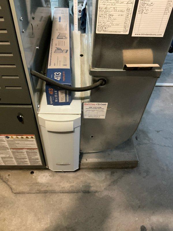 Provided estimate for complete furnace and air conditioning system replacement after identifying over 800 small cracks in the existing heat exchanger, which poses a safety hazard and requires immediate replacement. Documented current basement HVAC installation including existing gray furnace unit mounted on metal stand with associated ductwork and cream-colored AC unit, and presented financing options with promotional interest terms for the recommended system upgrade.